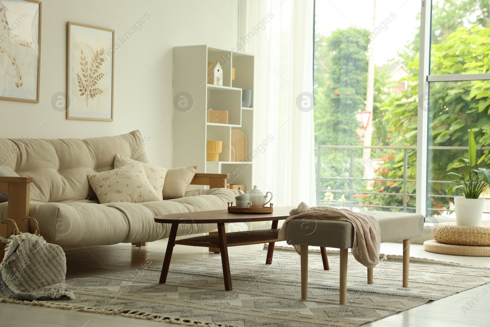 Coffee table, sofa, bench and decor in dining room. Interior design Photo of Coffee table, sofa, bench and decor in dining room. Interior design