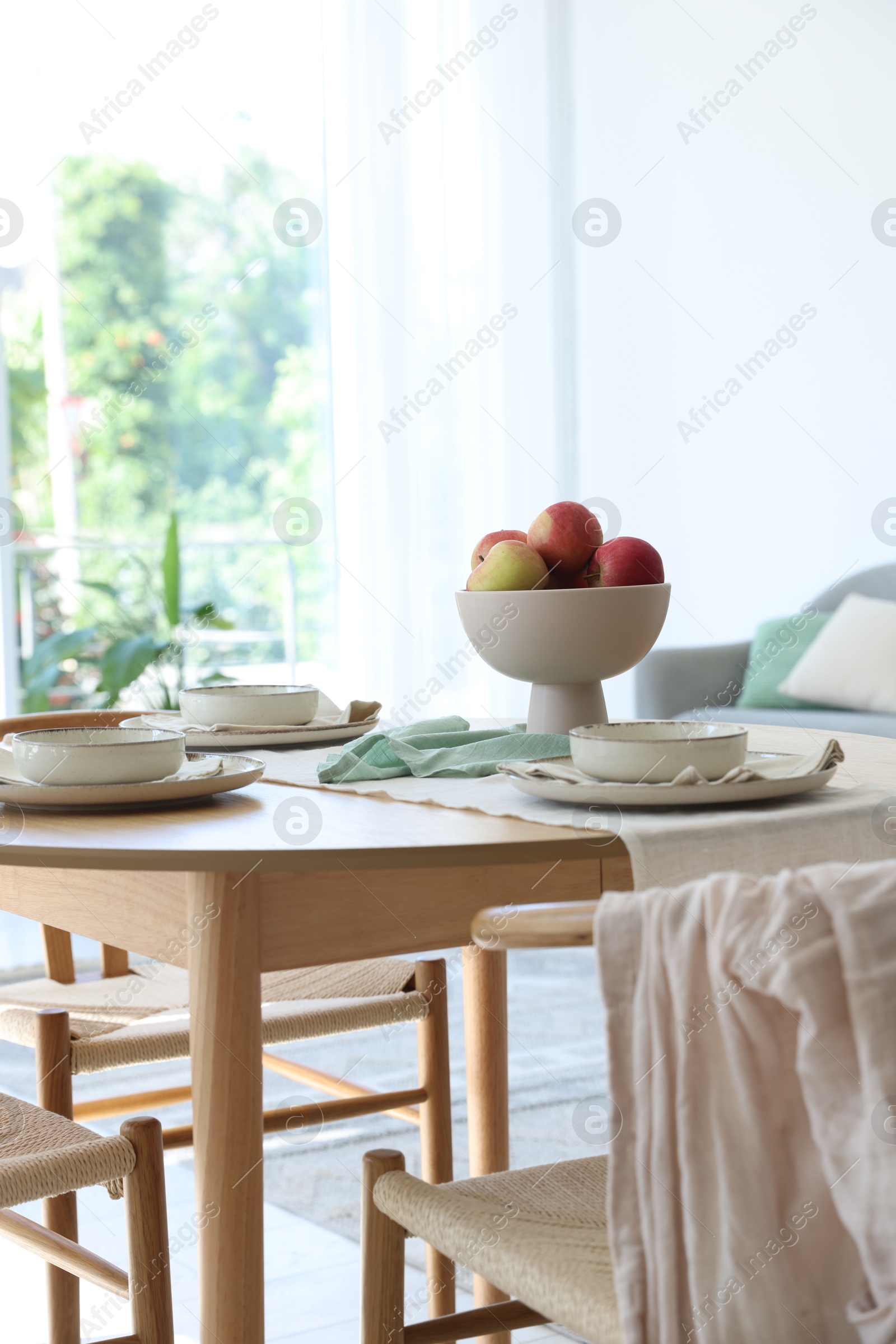 Photo of Stylish table setting, chairs and decor in dining room