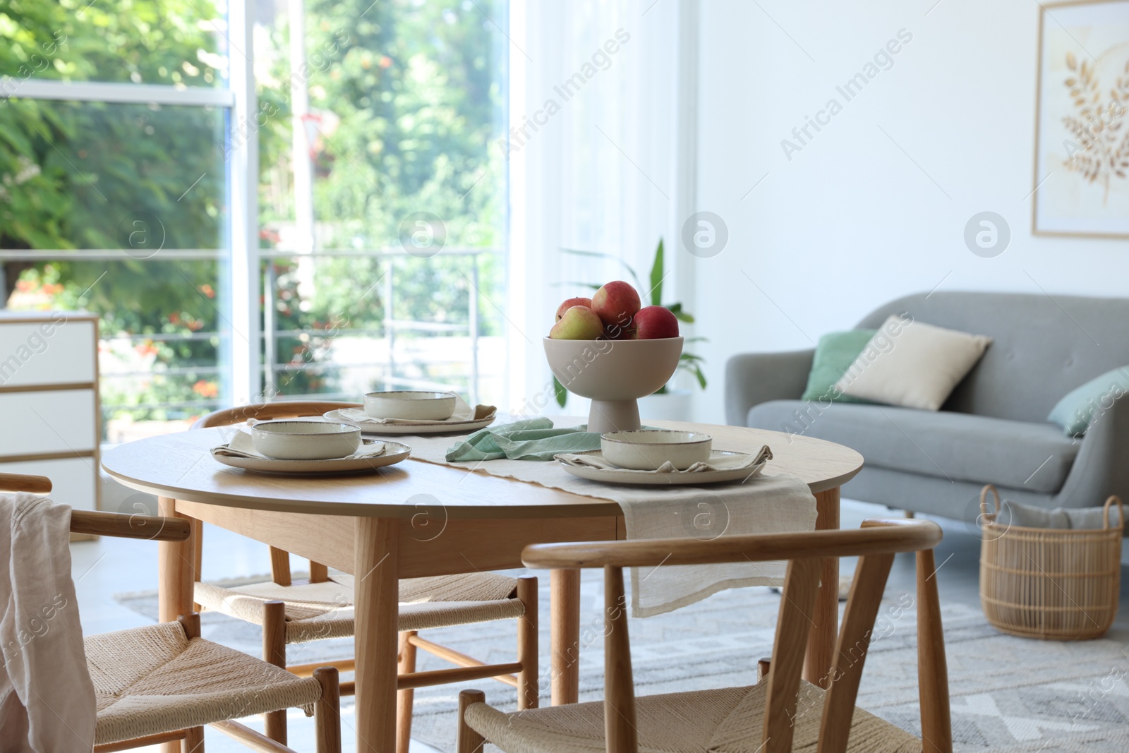 Photo of Stylish table setting, chairs and decor in dining room. Interior design