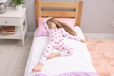 Photo of Little girl sleeping in bed at home