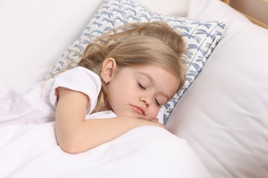 Photo of Little girl sleeping in bed at home