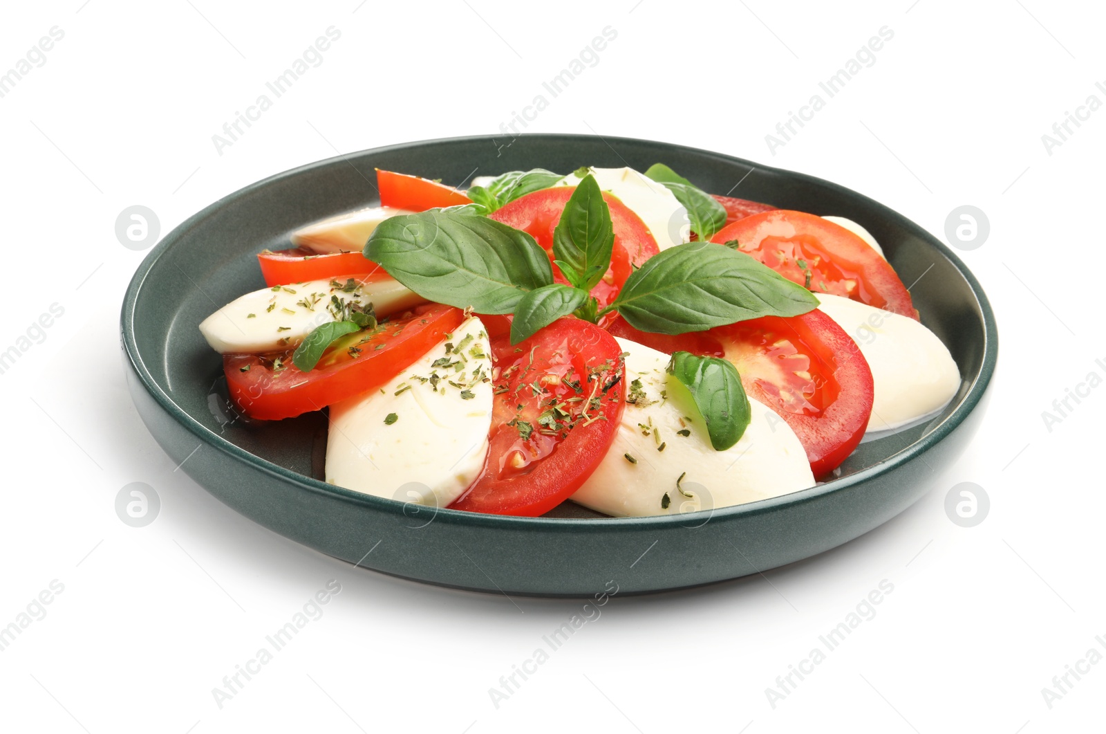 Tasty salad Caprese with mozzarella, tomatoes, basil and spices isolated on white Photo of Tasty salad Caprese with mozzarella, tomatoes, basil and spices isolated on white