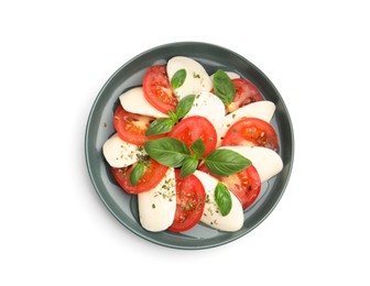 Photo of Tasty salad Caprese with mozzarella, tomatoes, basil and spices isolated on white, top view