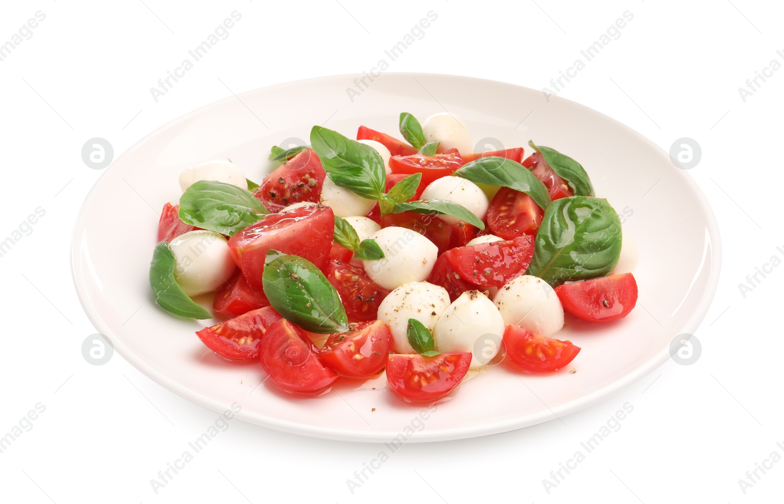Tasty salad Caprese with mozzarella, tomatoes, basil and spices isolated on white Photo of Tasty salad Caprese with mozzarella, tomatoes, basil and spices isolated on white