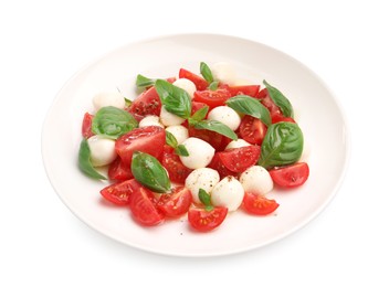Photo of Tasty salad Caprese with mozzarella, tomatoes, basil and spices isolated on white