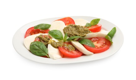 Photo of Tasty salad Caprese with mozzarella, tomatoes, basil and pesto sauce isolated on white