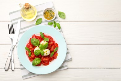 Photo of Tasty salad Caprese served on white wooden table, flat lay. Space for text
