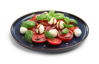Photo of Tasty salad Caprese with mozzarella, tomatoes, basil and balsamic vinegar isolated on white
