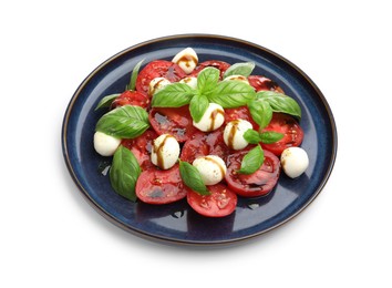 Photo of Tasty salad Caprese with mozzarella, tomatoes, basil and balsamic vinegar isolated on white