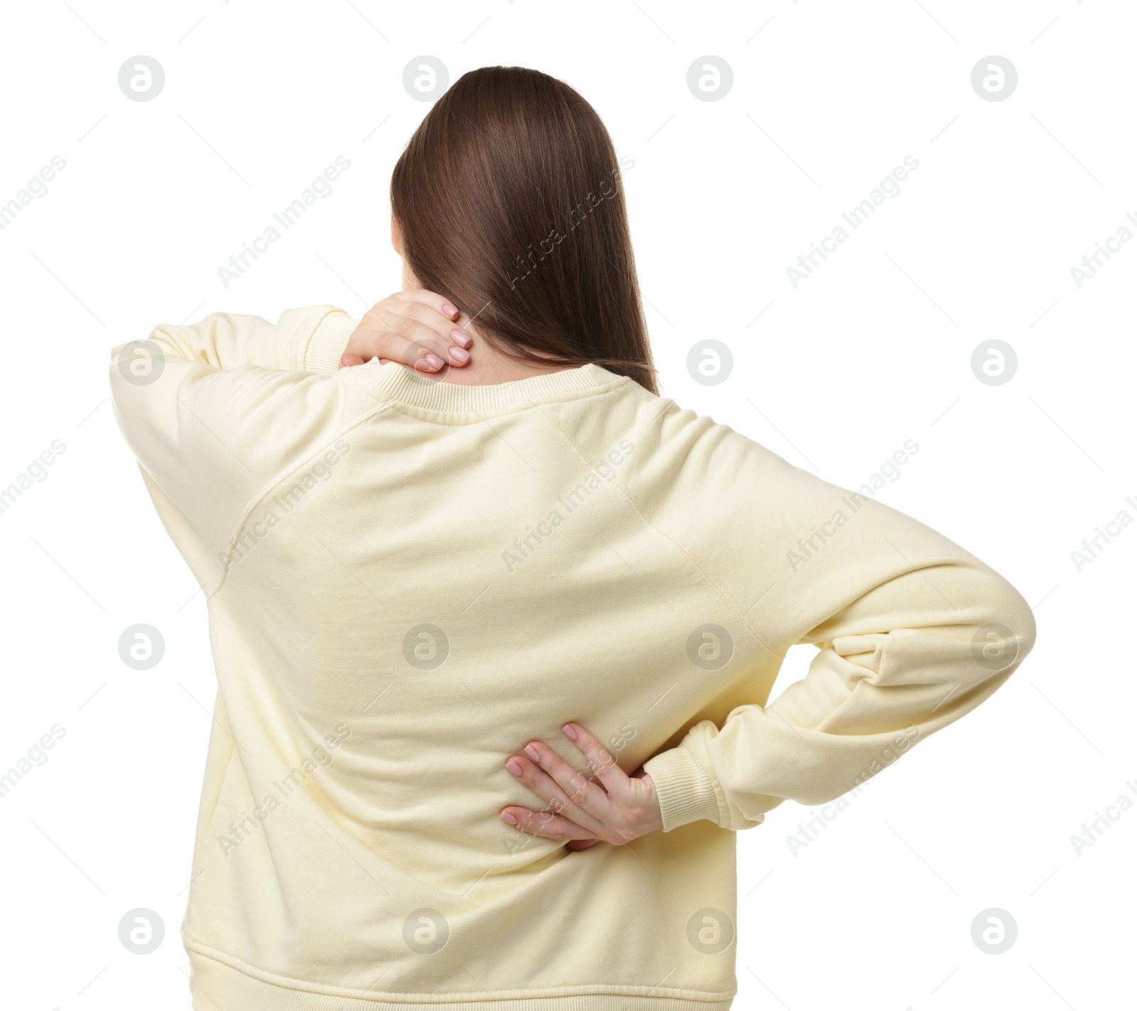 Woman suffering from back pain on white background Photo of Woman suffering from back pain on white background
