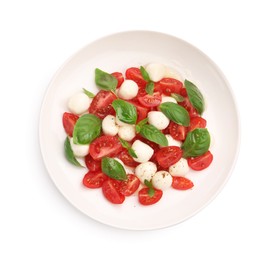 Photo of Tasty salad Caprese with mozzarella, tomatoes, basil and spices isolated on white, top view