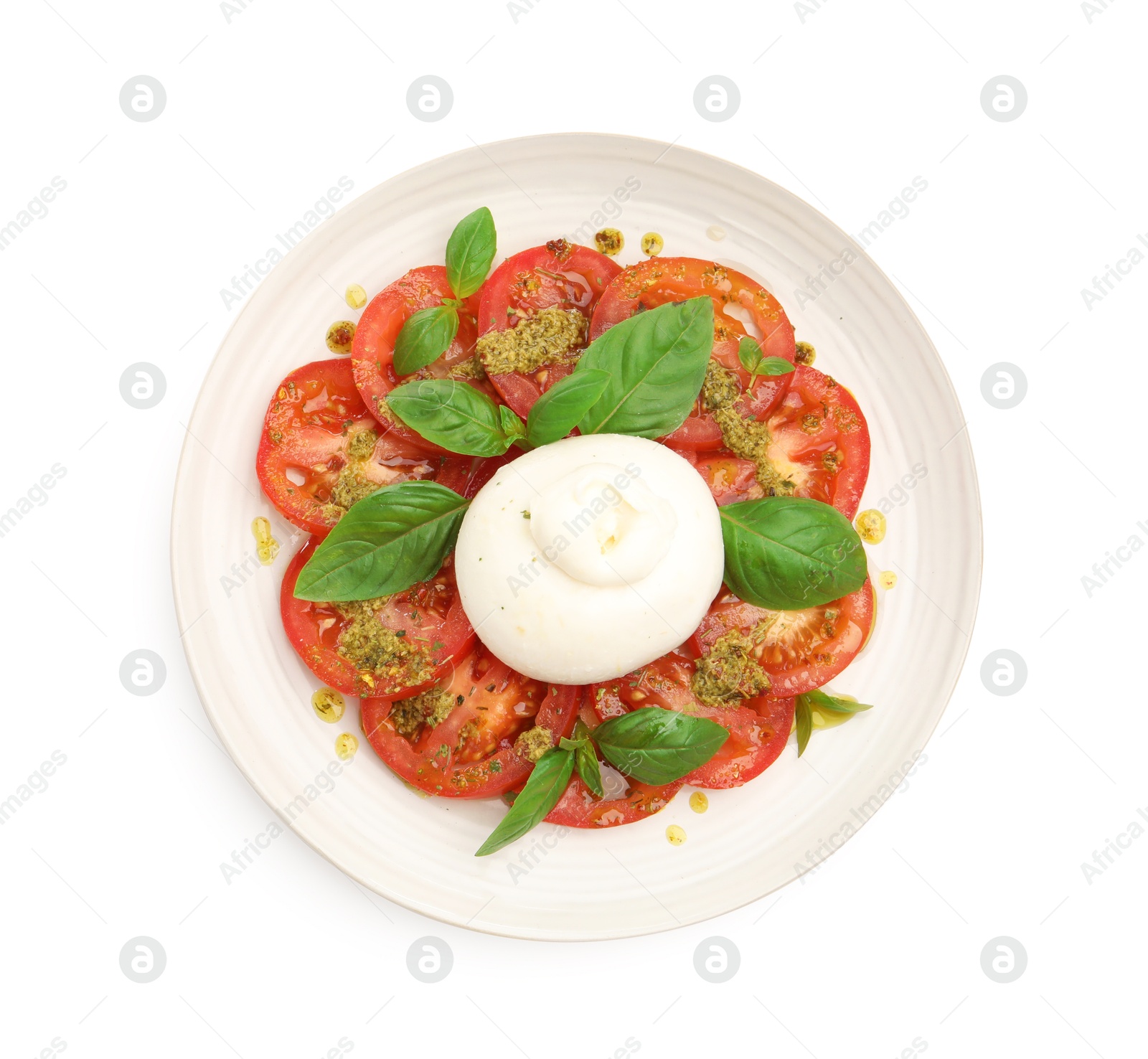 Photo of Tasty salad Caprese with mozzarella, tomatoes, basil and pesto sauce isolated on white, top view