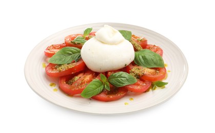Photo of Tasty salad Caprese with mozzarella, tomatoes, basil and pesto sauce isolated on white