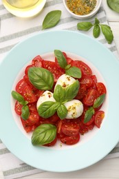 Photo of Tasty salad Caprese served on table, flat lay