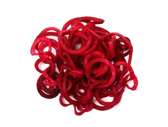 Photo of Raw beetroot noodles isolated on white, top view. Vegetarian dish