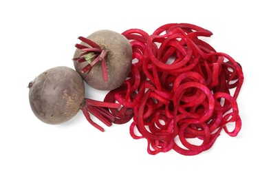 Photo of Raw beetroot noodles and fresh vegetables isolated on white, top view. Vegetarian dish