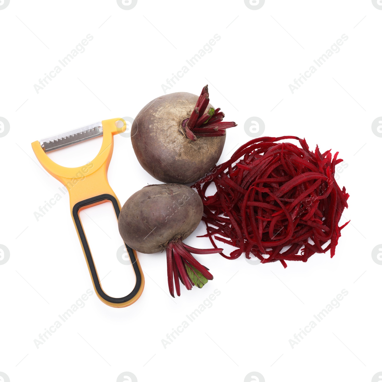 Photo of Raw beetroot noodles, fresh vegetables and peeler isolated on white, top view. Vegetarian dish