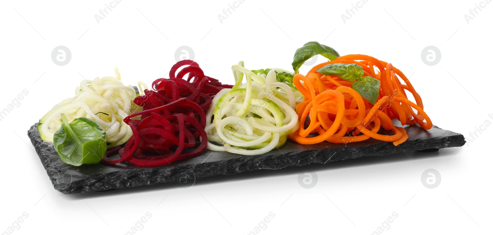 Photo of Different vegetable noodles with basil isolated on white. Vegetarian dish