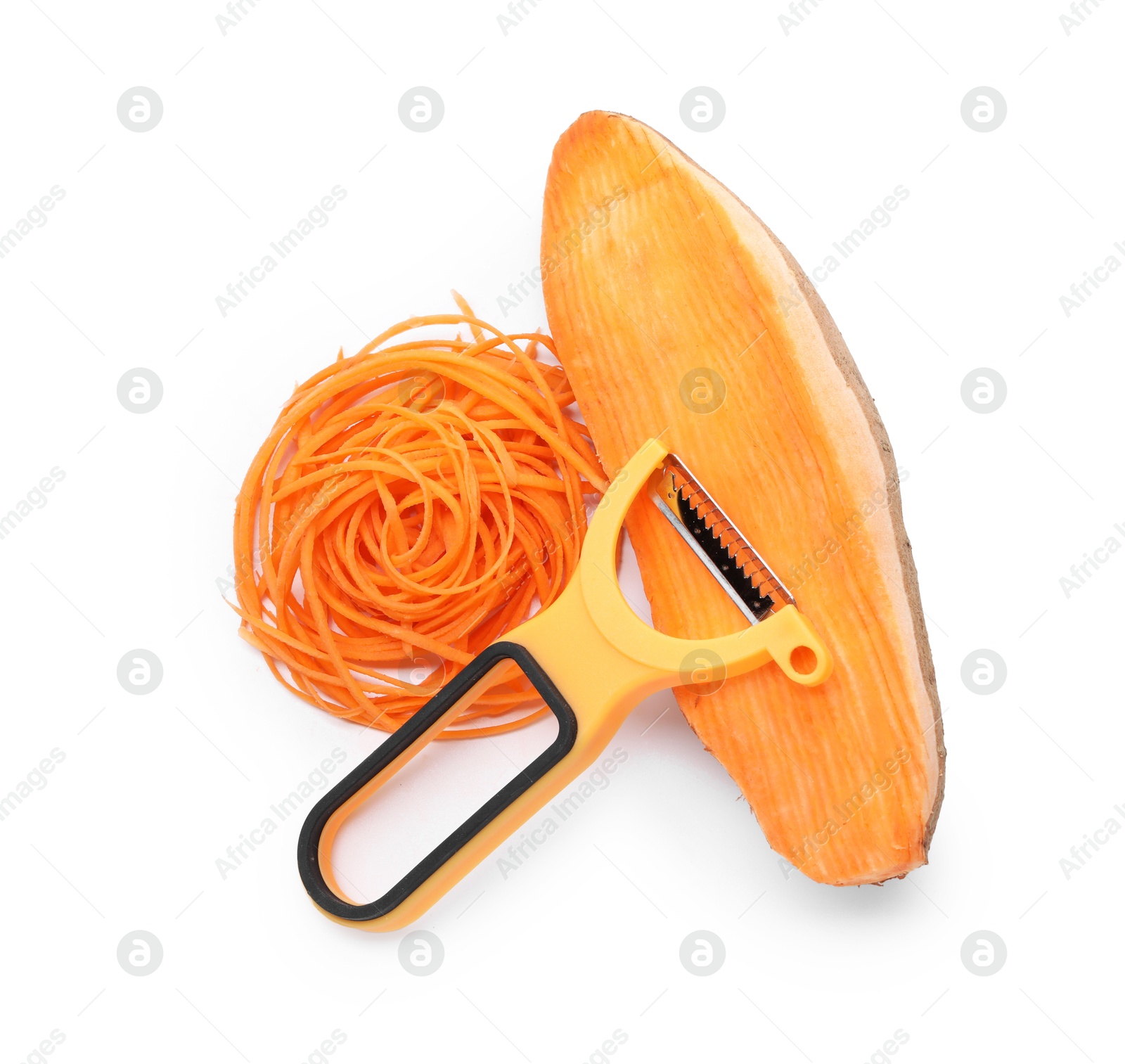 Photo of Vegetable noodles, sweet potato and peeler isolated on white, top view