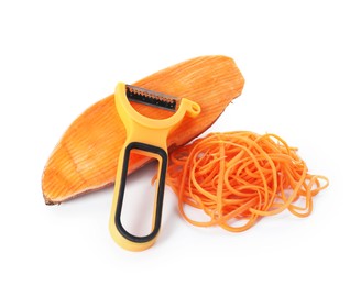 Photo of Vegetable noodles, sweet potato and peeler isolated on white