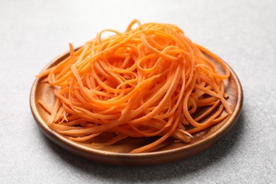 Photo of Fresh vegetable noodles on light table, closeup