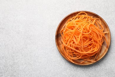 Photo of Vegetable noodles on light table, top view. Space for text