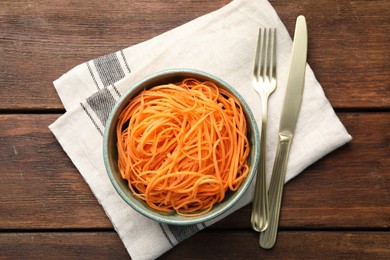 Photo of Vegetable noodles served on wooden table, top view