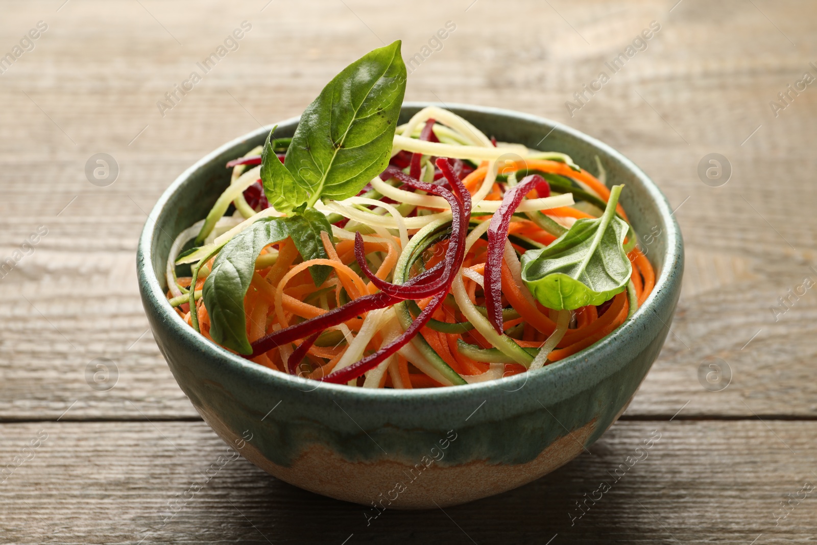 Tasty vegetable noodles on wooden table, closeup Photo of Tasty vegetable noodles on wooden table, closeup