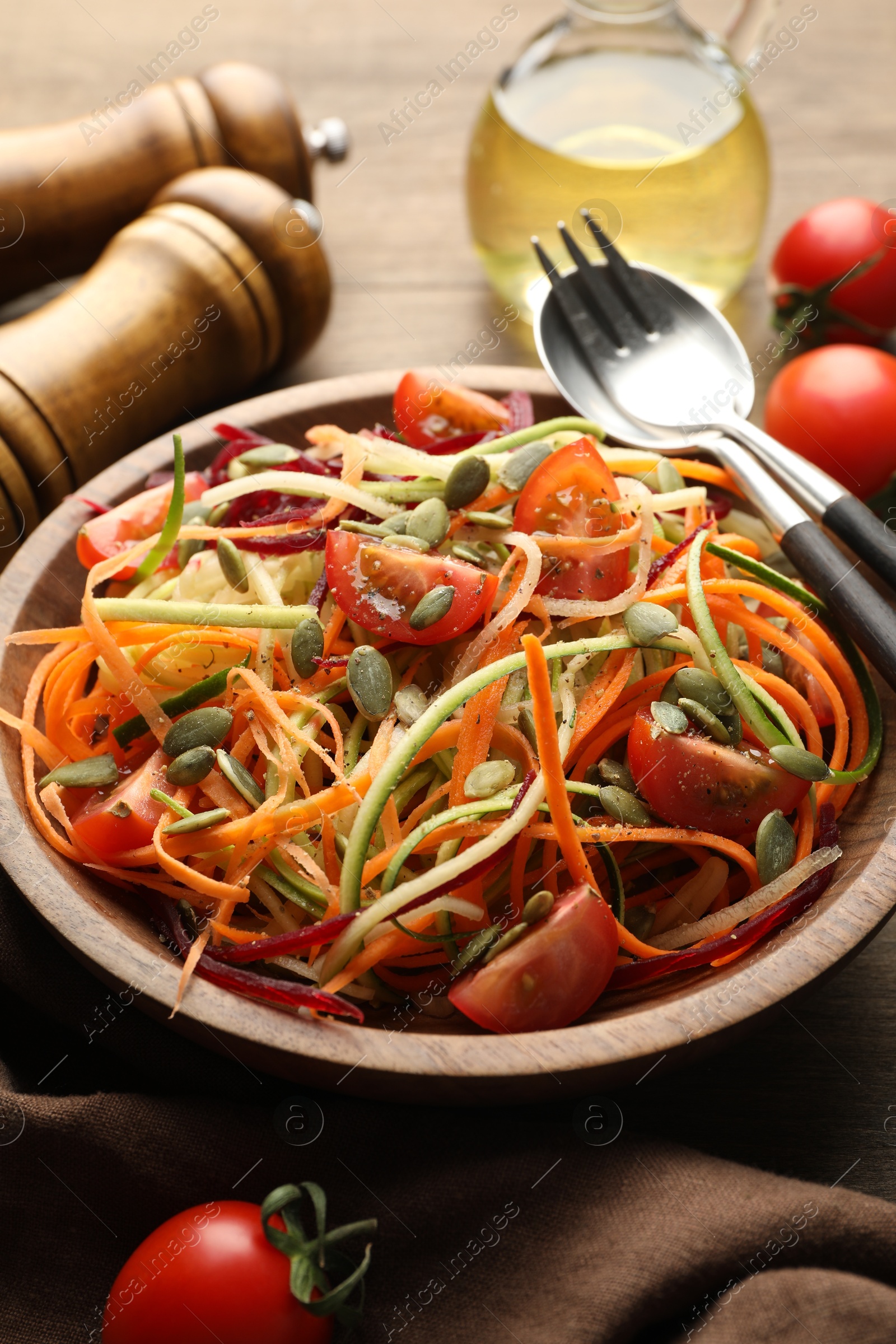 Tasty vegetable noodles served on wooden table, closeup Photo of Tasty vegetable noodles served on wooden table, closeup