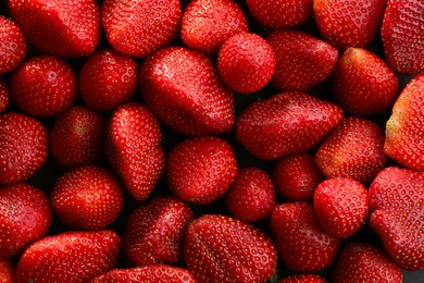 Photo of Fresh ripe strawberries as background, top view