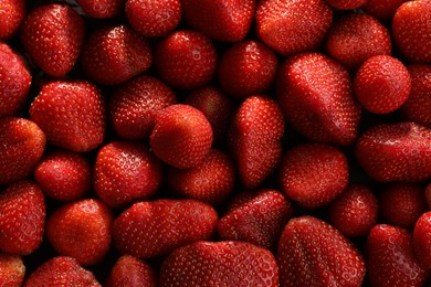 Photo of Fresh ripe strawberries as background, top view