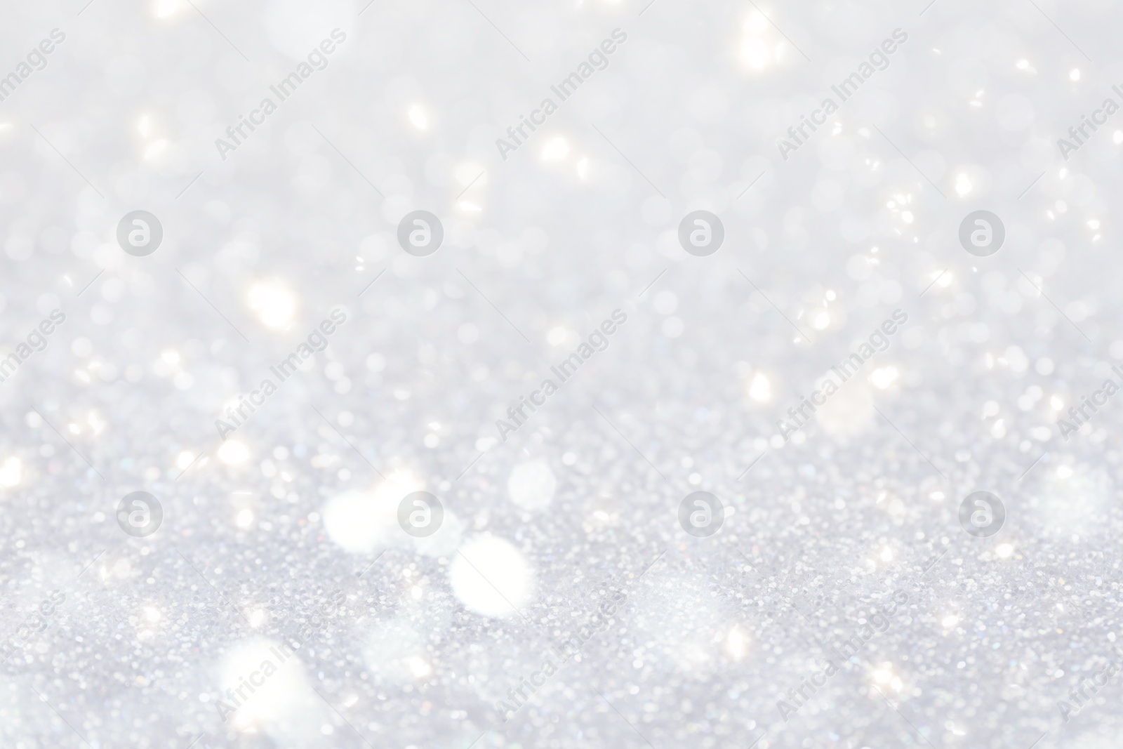Shiny silver background with sparkling glitter, bokeh effect Image of Shiny silver background with sparkling glitter, bokeh effect