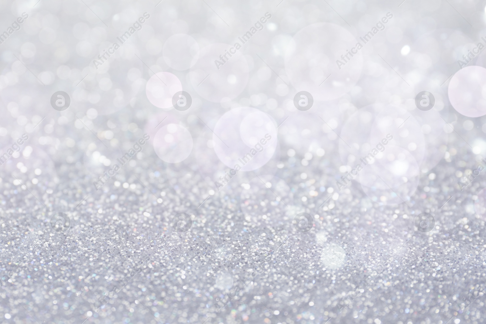 Shiny silver background with sparkling glitter, bokeh effect Image of Shiny silver background with sparkling glitter, bokeh effect