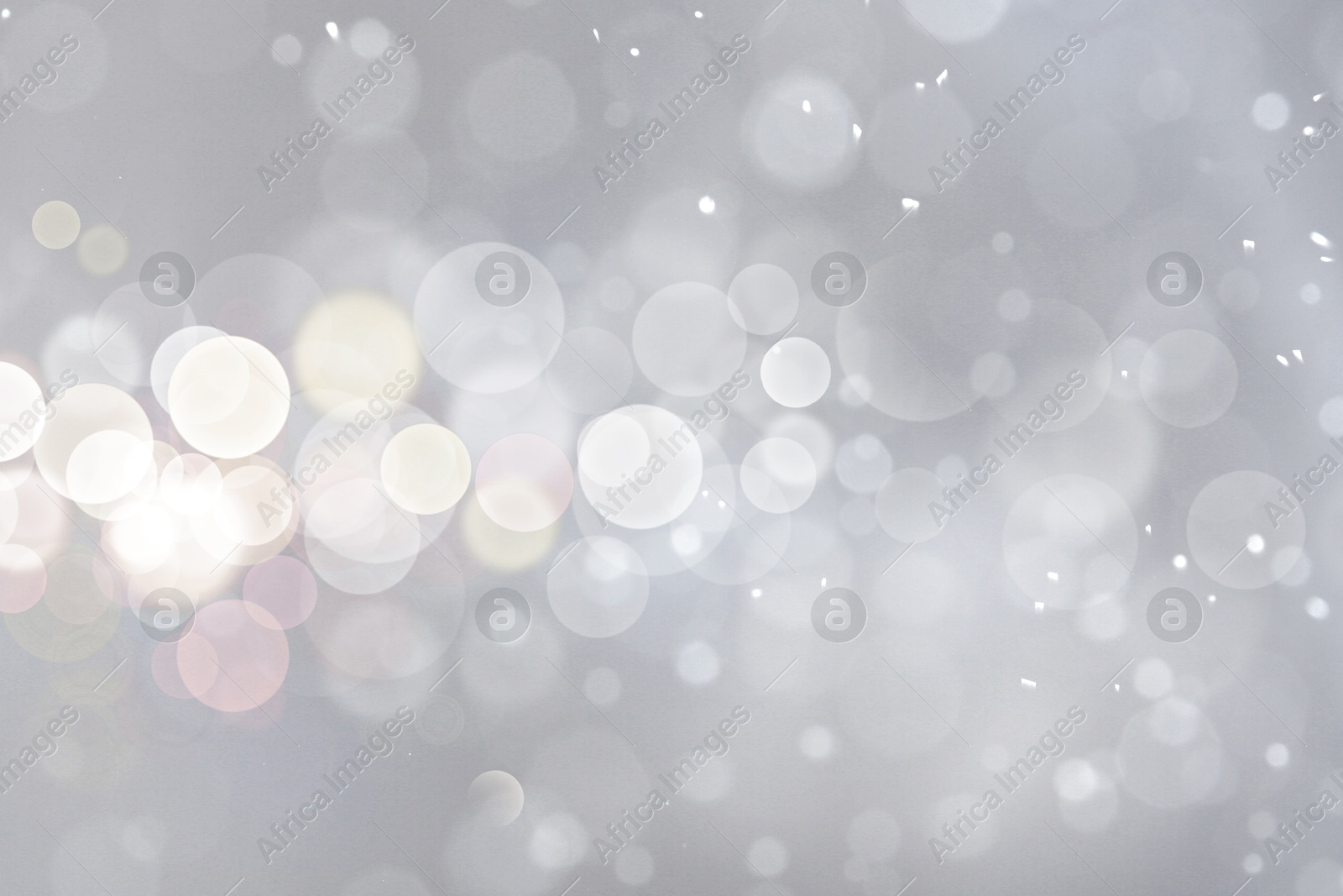 Shiny silver background with sparkling glitter, bokeh effect Image of Shiny silver background with sparkling glitter, bokeh effect