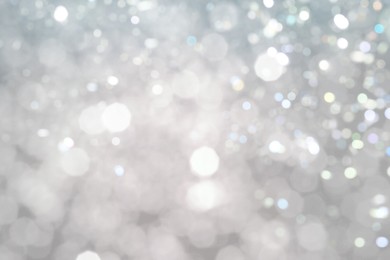 Image of Blurred shiny silver background with sparkling glitter, bokeh effect