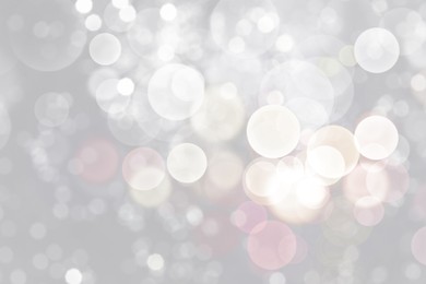Image of Blurred shiny silver background with sparkling glitter, bokeh effect