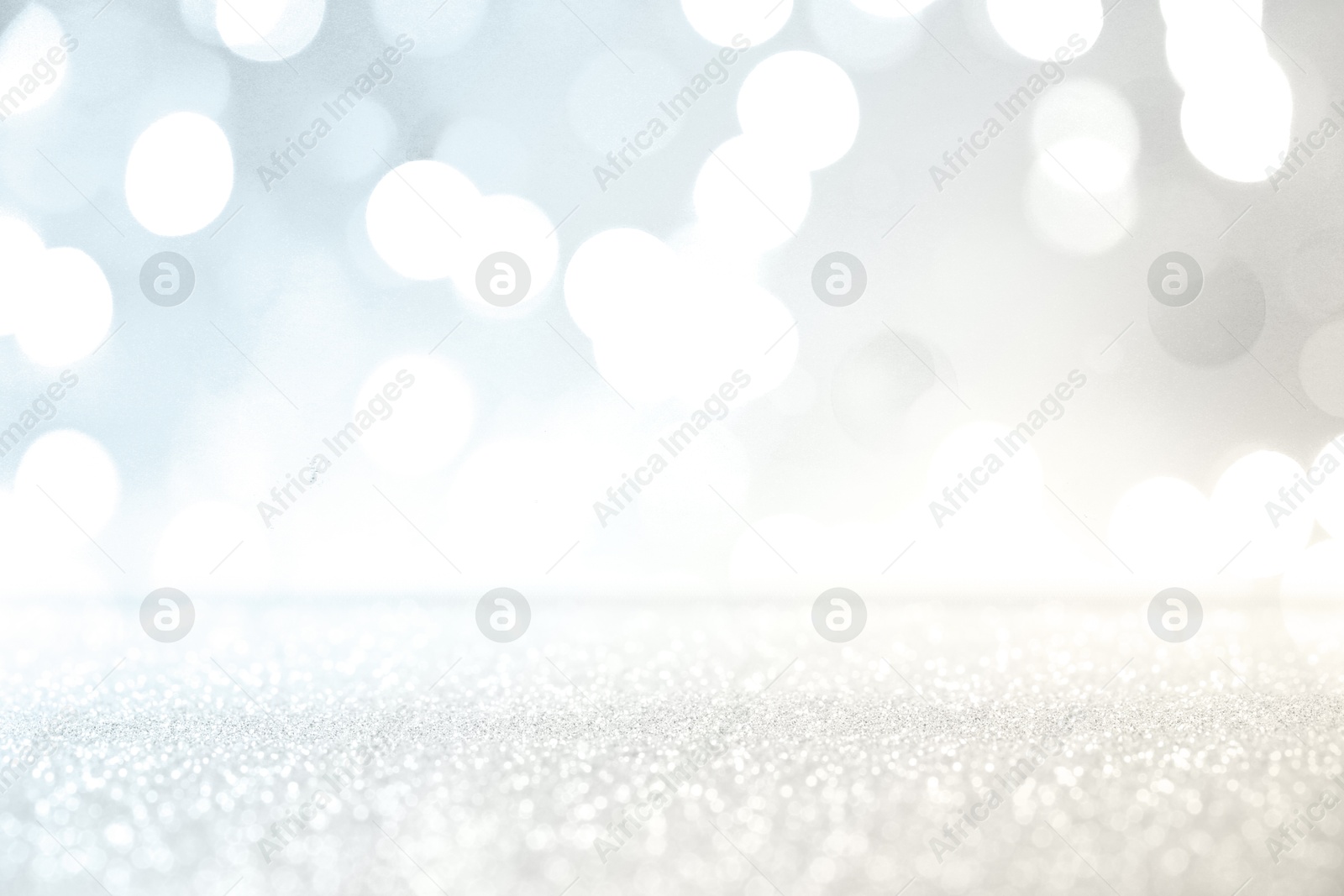 Shiny silver background with sparkling glitter, bokeh effect Image of Shiny silver background with sparkling glitter, bokeh effect