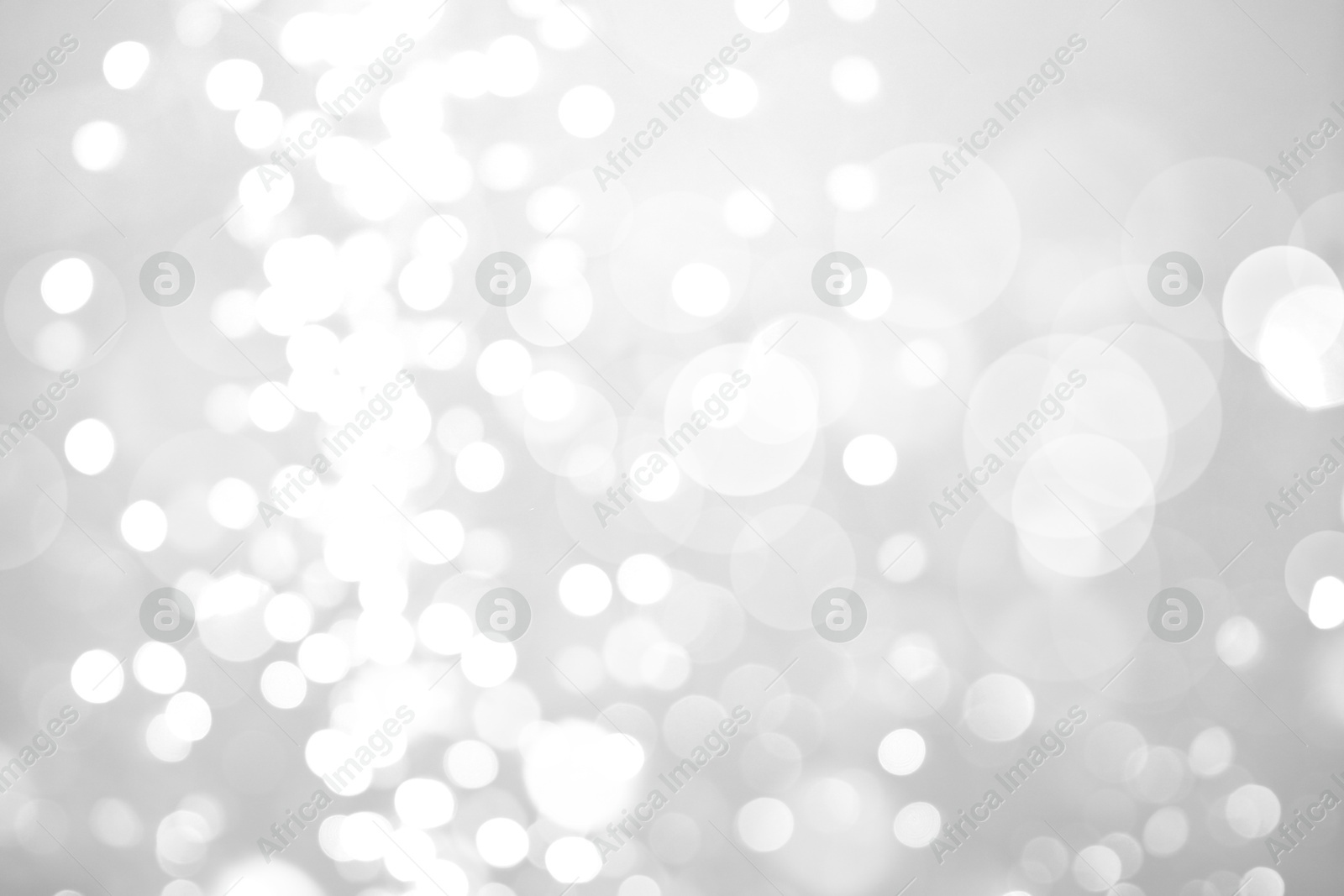 Image of Blurred shiny silver background with sparkling glitter, bokeh effect