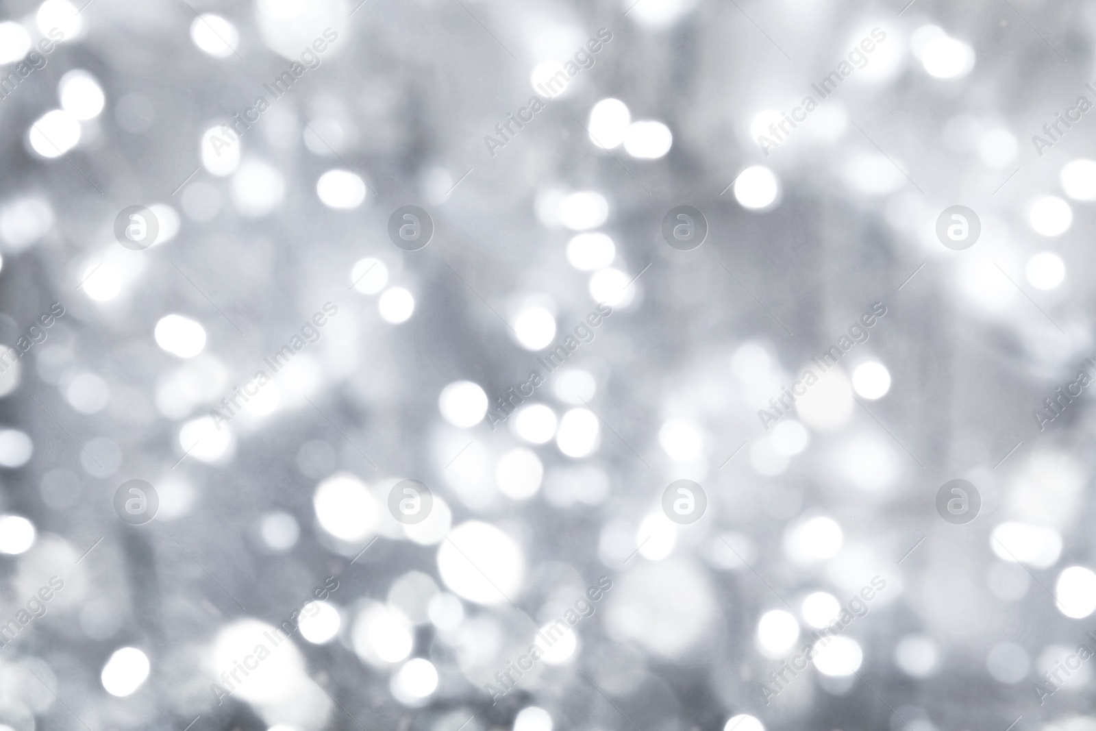 Image of Blurred shiny silver background with sparkling glitter, bokeh effect