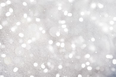 Image of Shiny silver background with sparkling glitter, bokeh effect