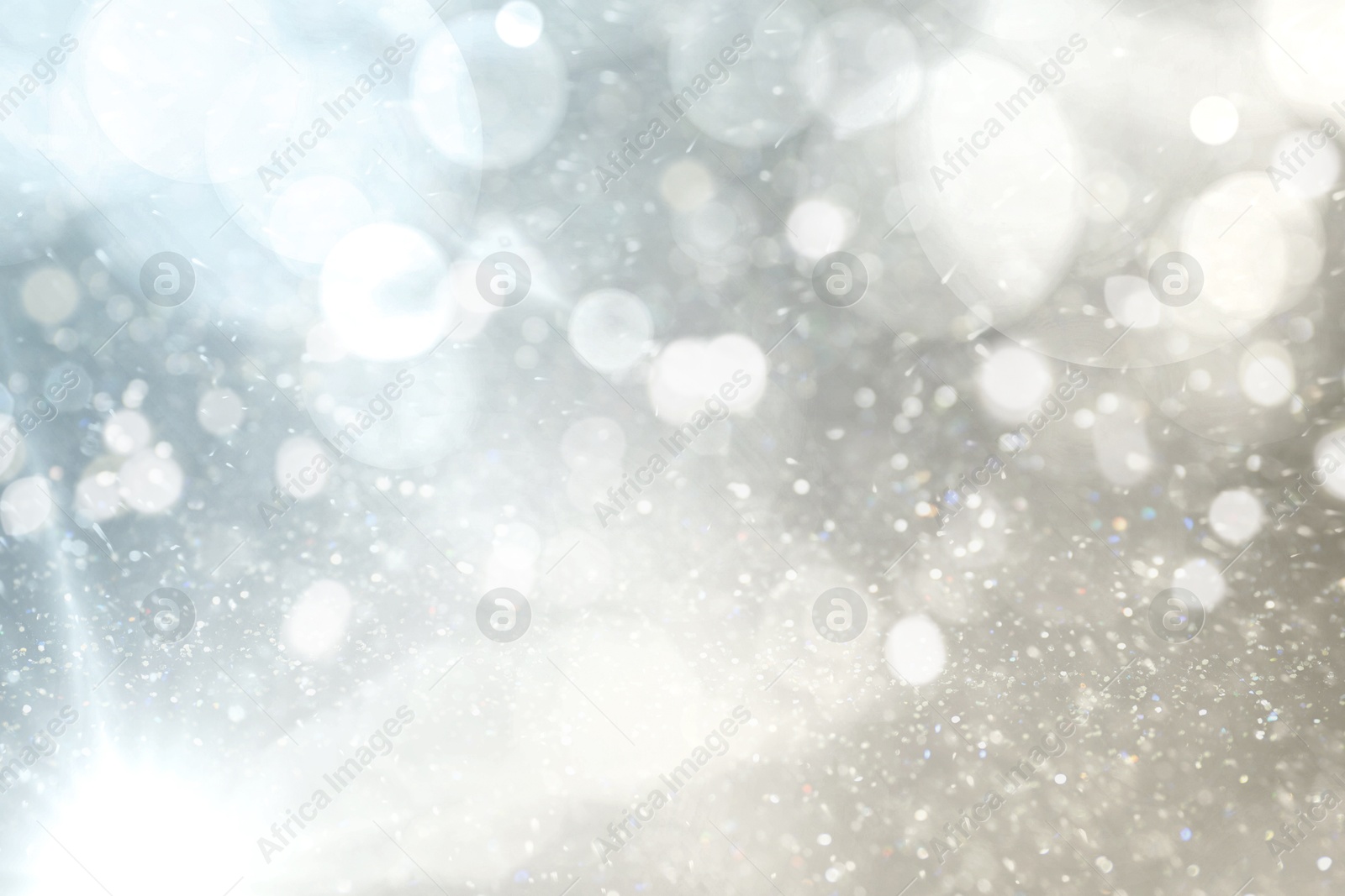 Shiny silver background with sparkling glitter, bokeh effect Image of Shiny silver background with sparkling glitter, bokeh effect