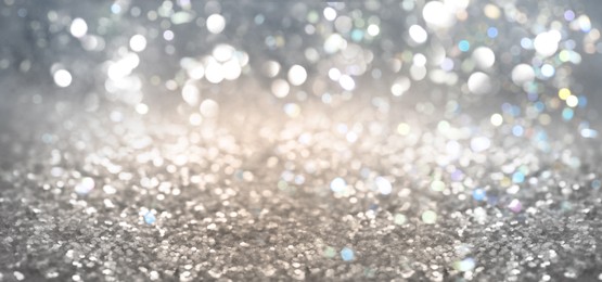 Image of Shiny silver background with sparkling glitter, bokeh effect
