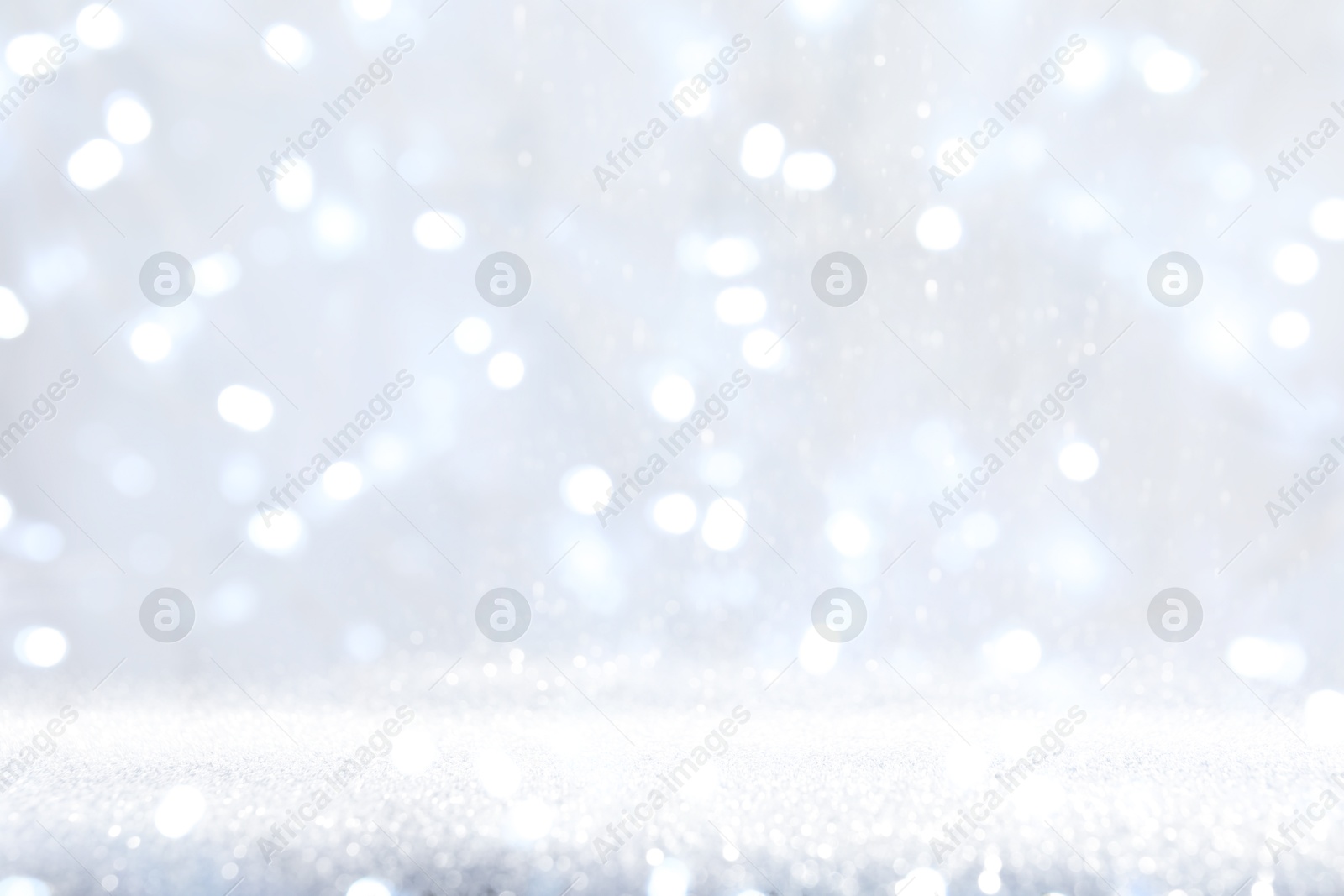 Shiny silver background with sparkling glitter, bokeh effect Image of Shiny silver background with sparkling glitter, bokeh effect