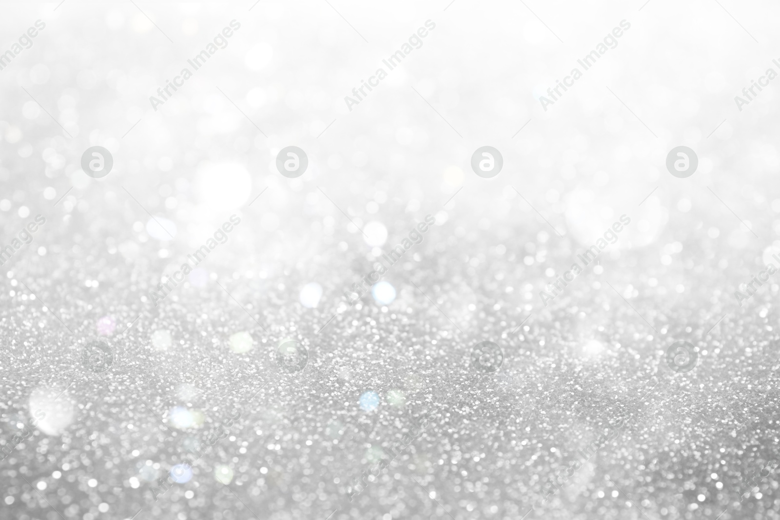 Shiny silver background with sparkling glitter, bokeh effect Image of Shiny silver background with sparkling glitter, bokeh effect