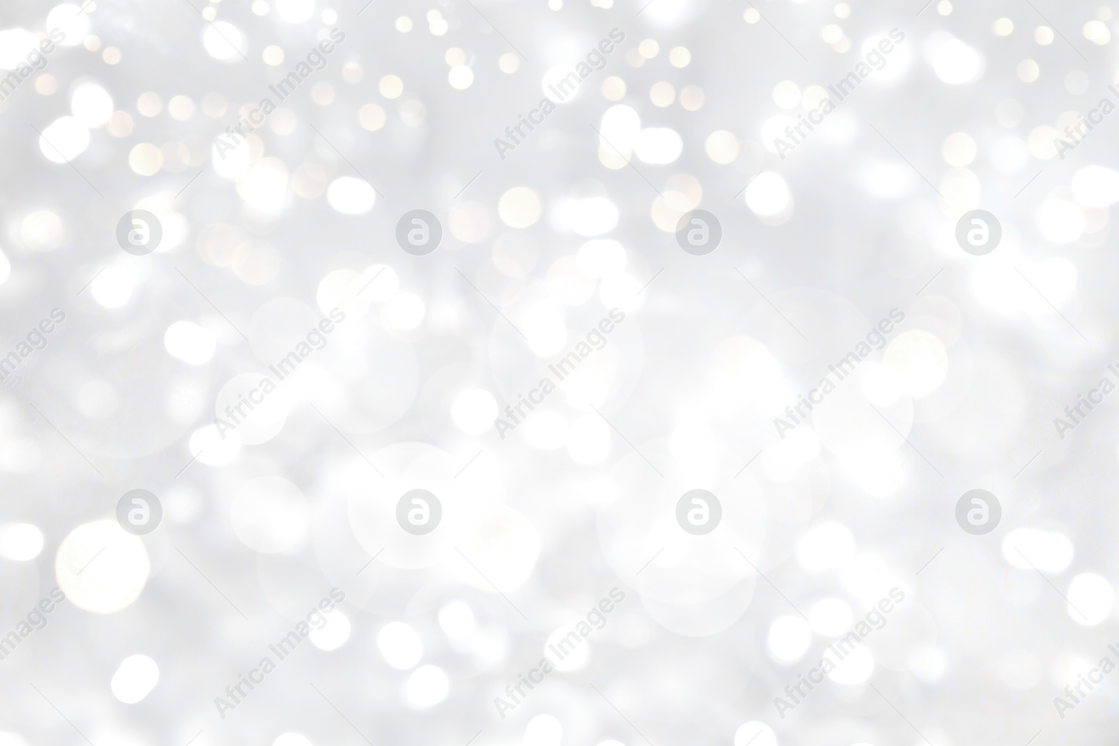 Image of Blurred shiny silver background with sparkling glitter, bokeh effect