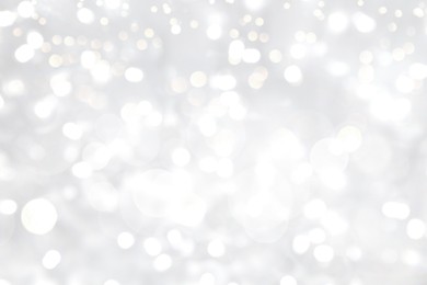 Image of Blurred shiny silver background with sparkling glitter, bokeh effect