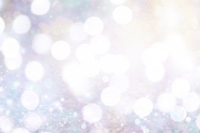 Image of Blurred shiny silver background with sparkling glitter, bokeh effect