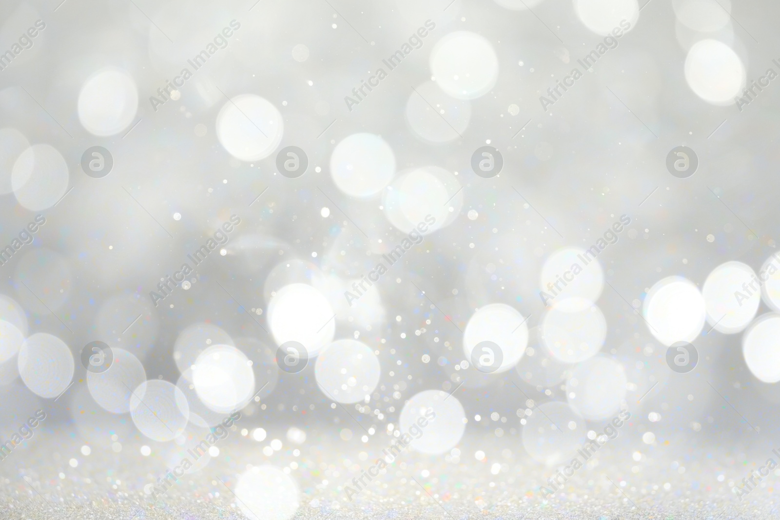 Image of Blurred shiny silver background with sparkling glitter, bokeh effect