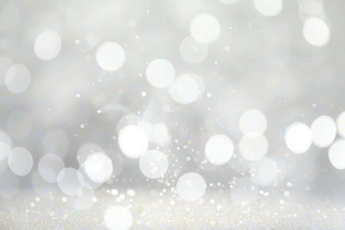 Image of Blurred shiny silver background with sparkling glitter, bokeh effect