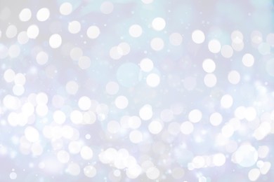 Image of Blurred shiny silver background with sparkling glitter, bokeh effect